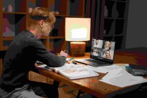 young man learning in a virtual classroom